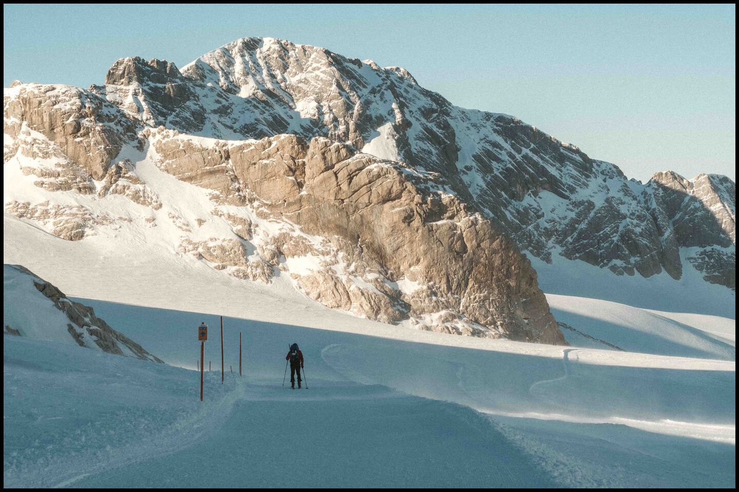 cross-country skier walking towards glacier peak